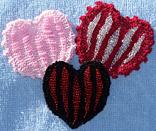 Image of 3 finished Bead Knitted Hearts